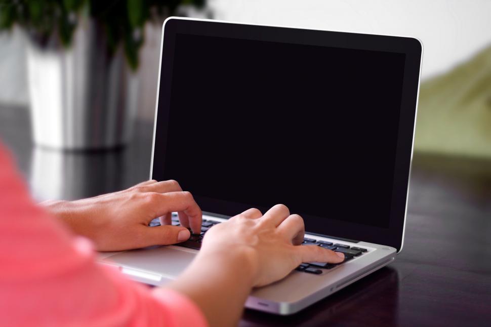 Free Image of Person Typing on Laptop on Table 