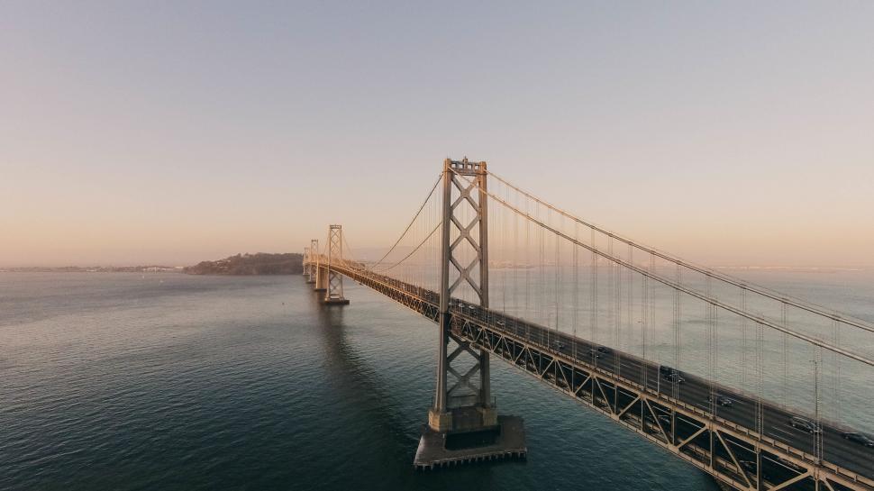 Free Image of Aerial View of Bridge Spanning Body of Water 