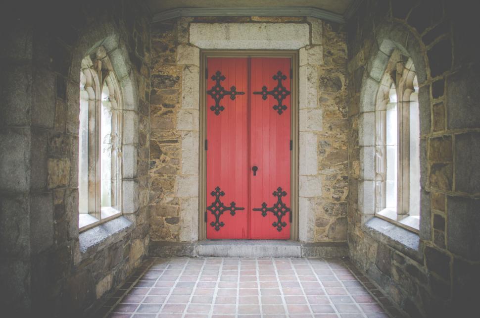 Free Image of Red Door and Two Windows in Stone Building 