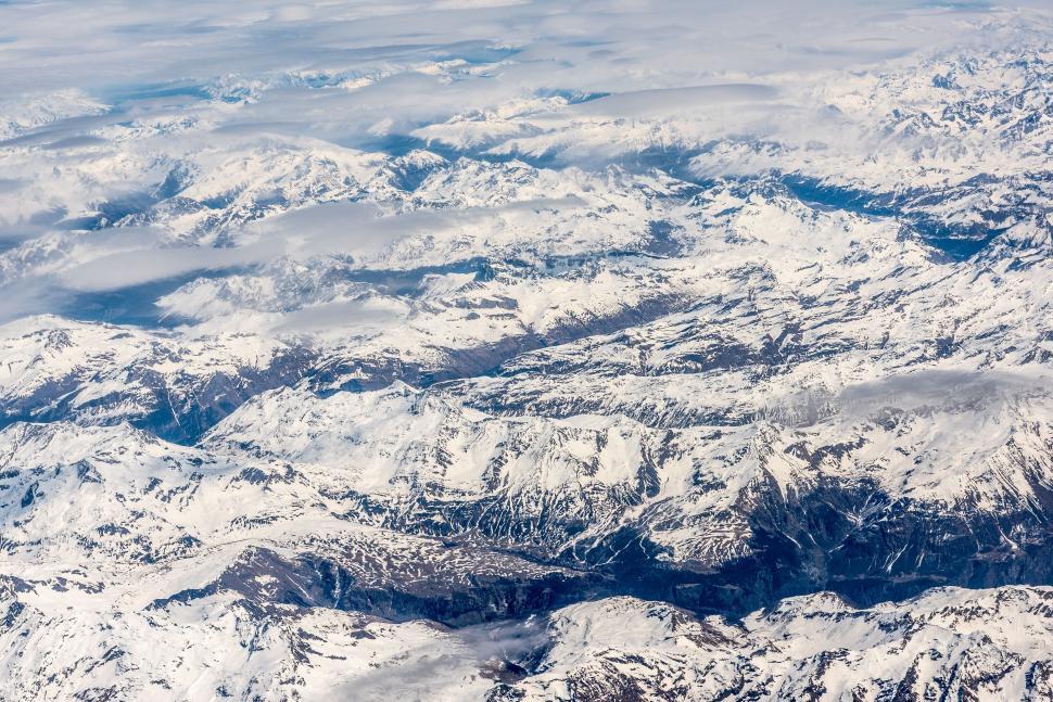Free Image of A View of a Mountain Range From an Airplane 