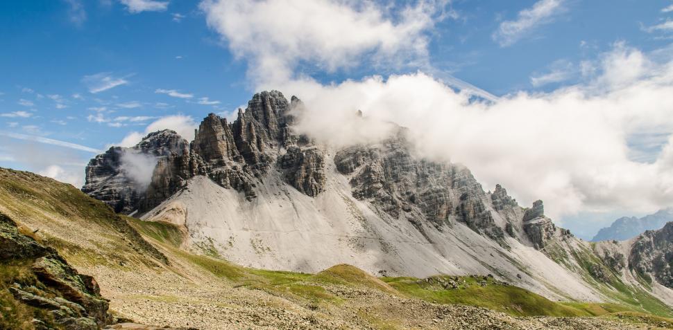 Free Image of Majestic Mountain Peak Amidst Clouds 