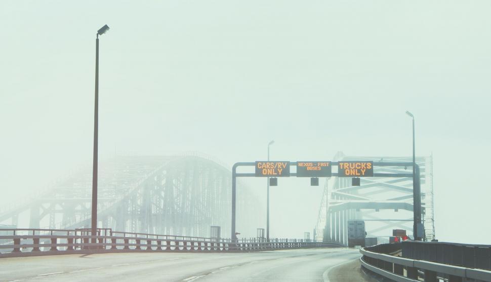 Free Image of Snowy Day Road With Bridge 