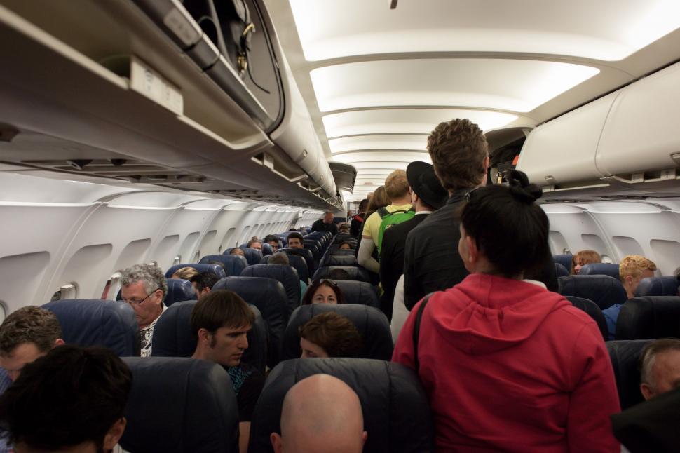 Free Image of Group of People Sitting on an Airplane 