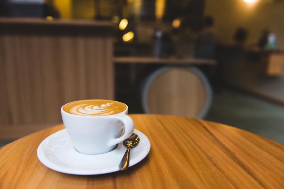 Free Image of A Cup of Coffee on Wooden Table 