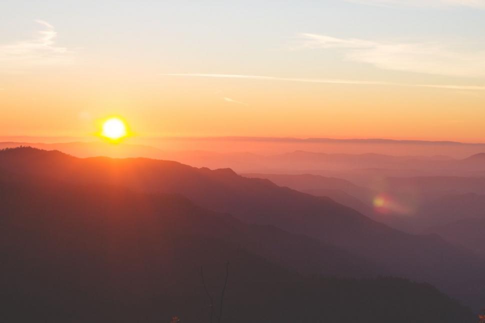 Free Image of Sun Setting Over Mountain Range 