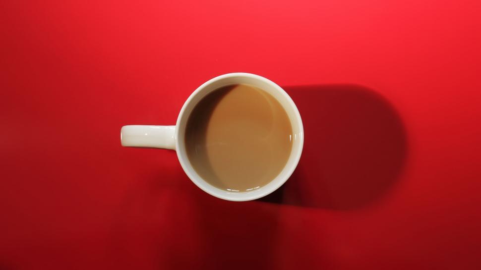 Free Image of A Cup of Coffee on a Red Table 