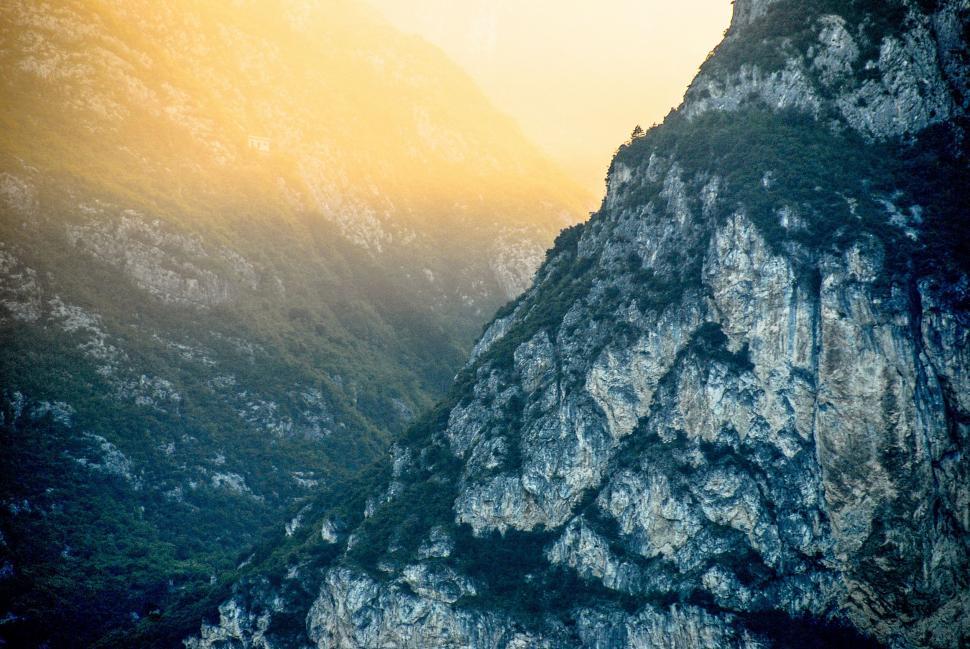 Free Image of A Bird Perched on Top of a Mountain 