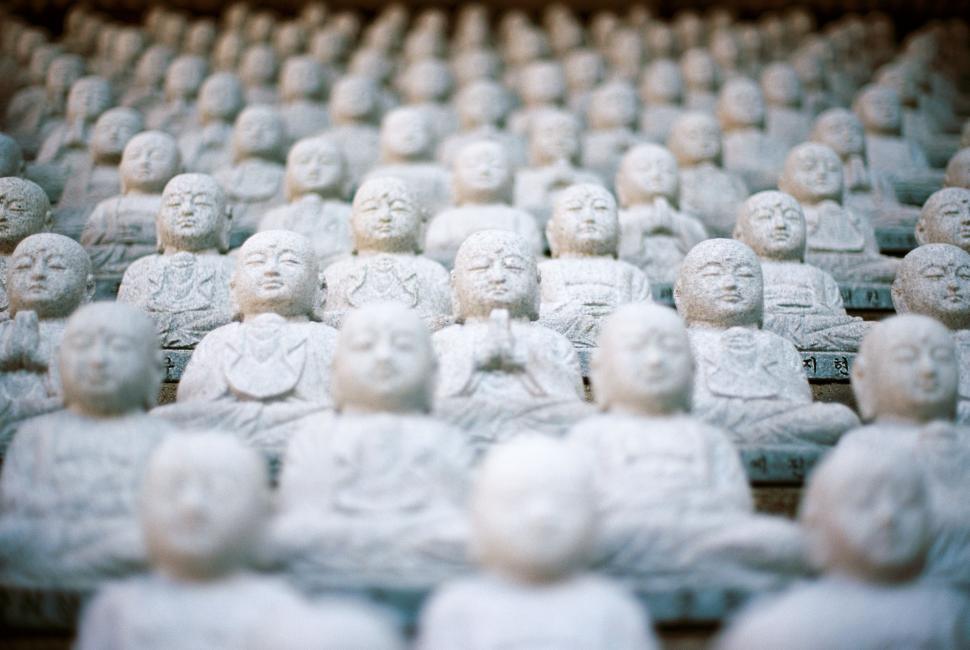 Free Image of Group of Buddha Statues on Table 