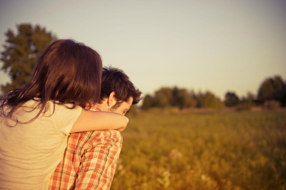 Free Image of Couple Embracing in Field 