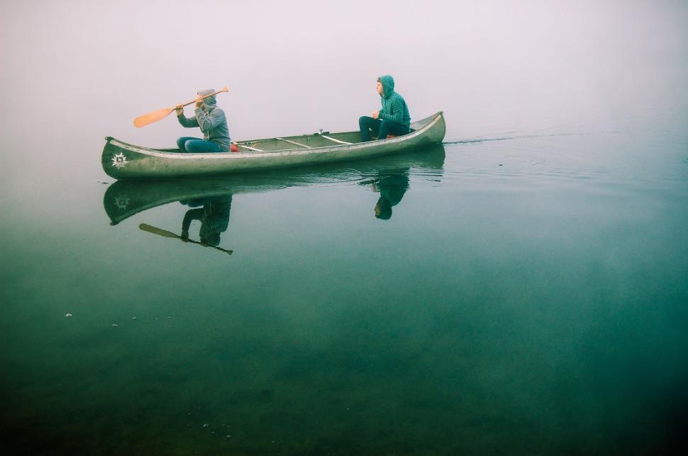 Free Image of Two People Canoeing on a Foggy Day 