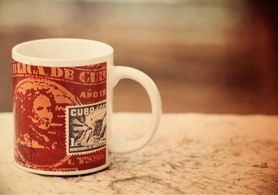 Free Image of Red and White Coffee Mug on Counter 