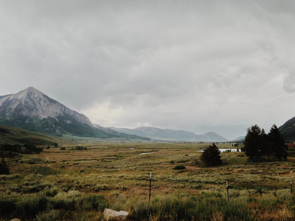 Free Image of Field With Mountain in Background 