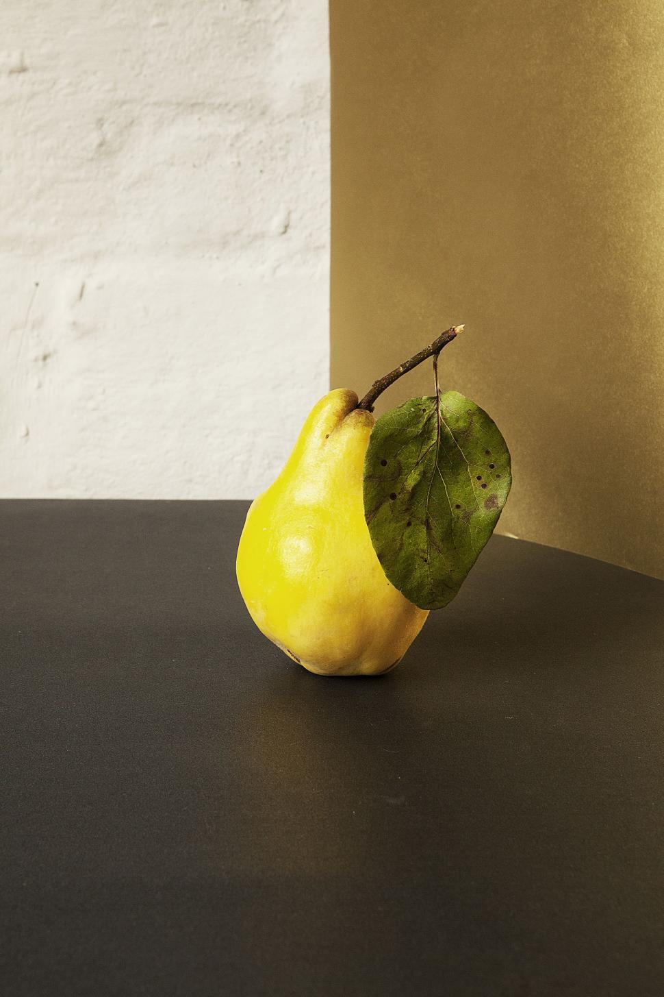 Free Image of Yellow Pear on Black Table 