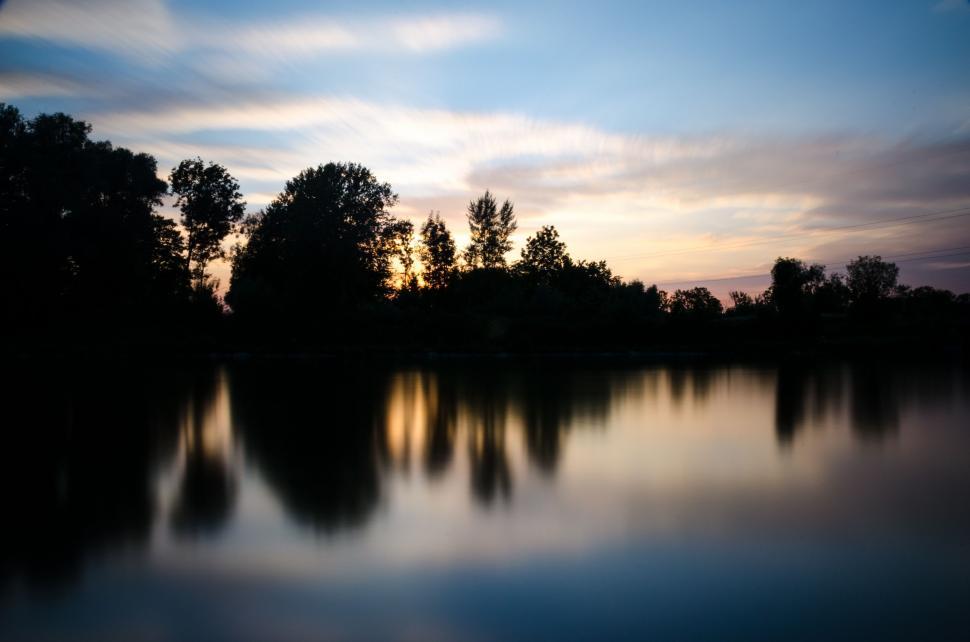 Free Image of Water Body With Trees in Background 