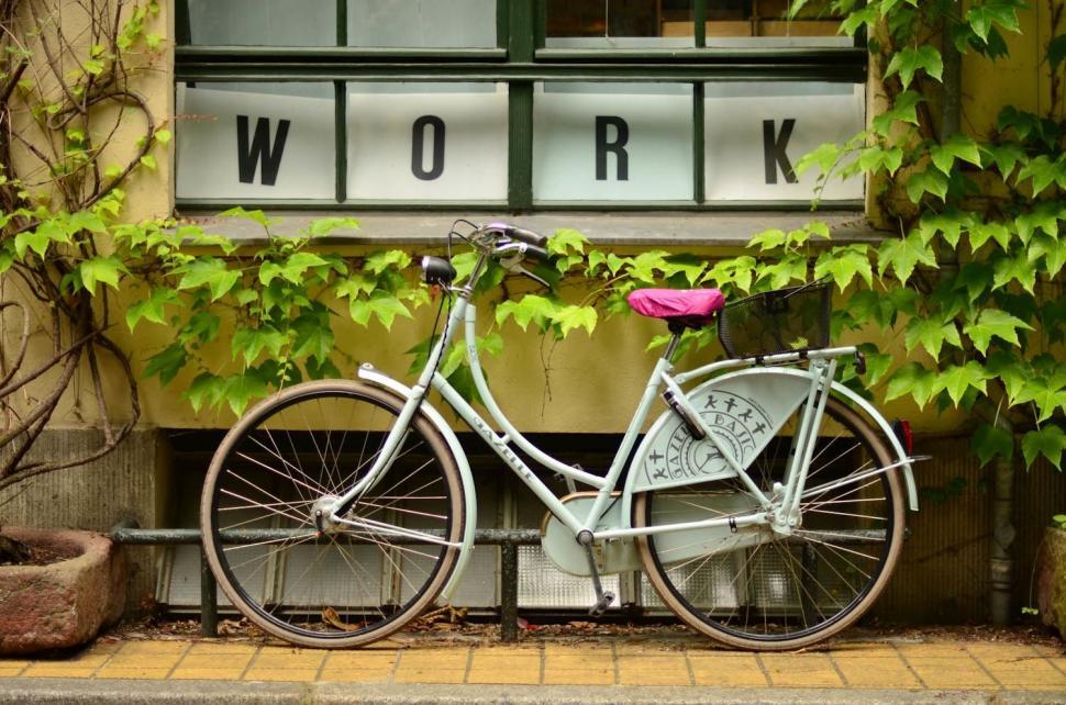 Free Image of Bicycle Parked in Front of Window 