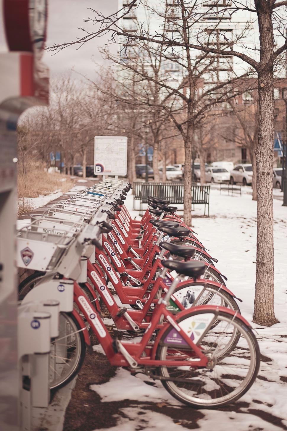 Free Image of A Row of Red Bikes Parked Next to Each Other 