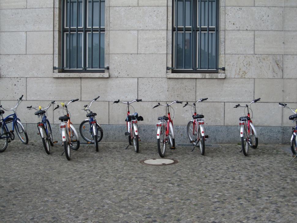 Free Image of Row of Bikes Parked in Front of Building 