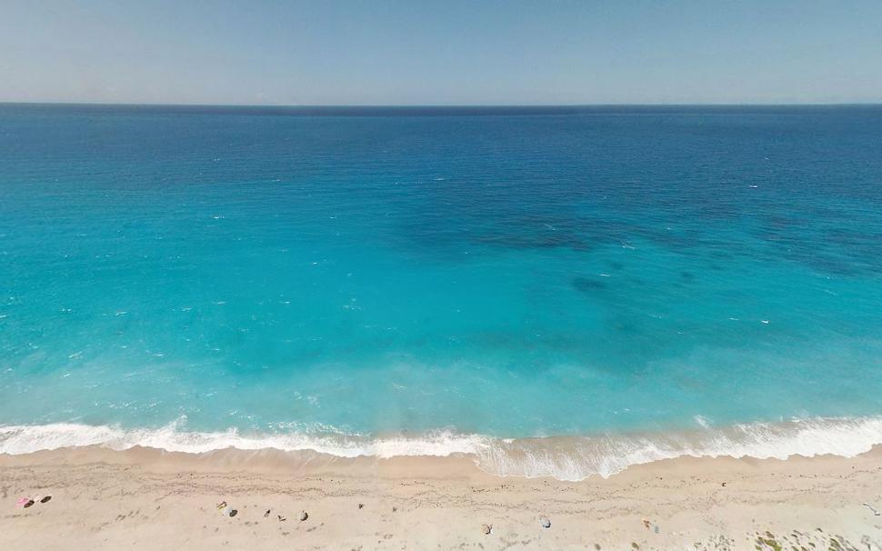 Free Image of Aerial View of a Beach With Blue Water 