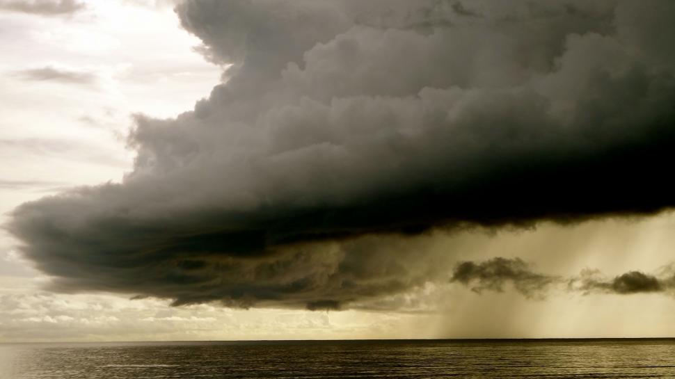 Free Image of Large Cloud Over Body of Water 