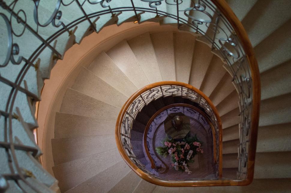 Free Image of A View of a Spiral Staircase From the Bottom 
