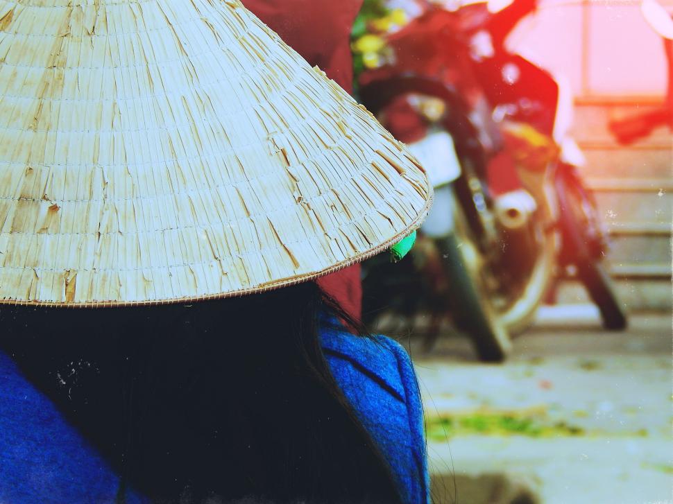 Free Image of Woman Wearing Straw Hat Outdoors 