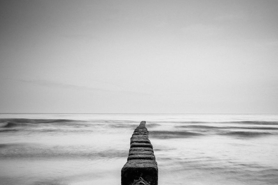 Free Image of Long Pier Stretching Into the Horizon 