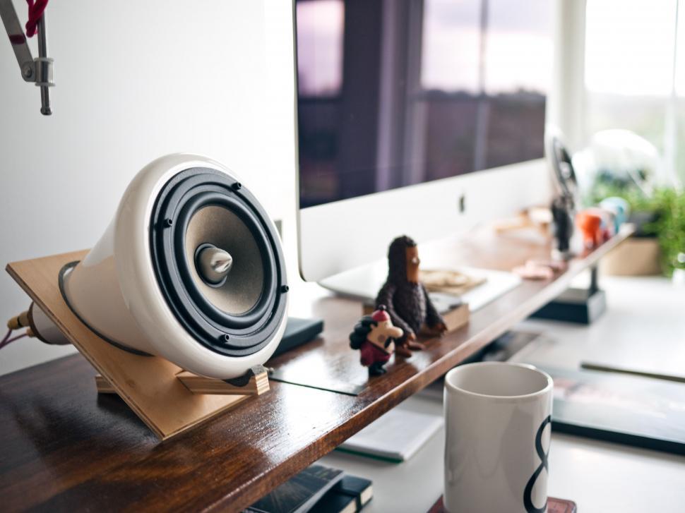 Free Image of Desk With Coffee Cup and Speakers 
