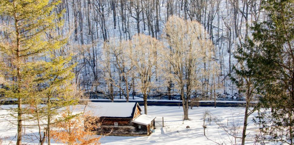 Free Image of Snow-Covered Cabin in the Woods 