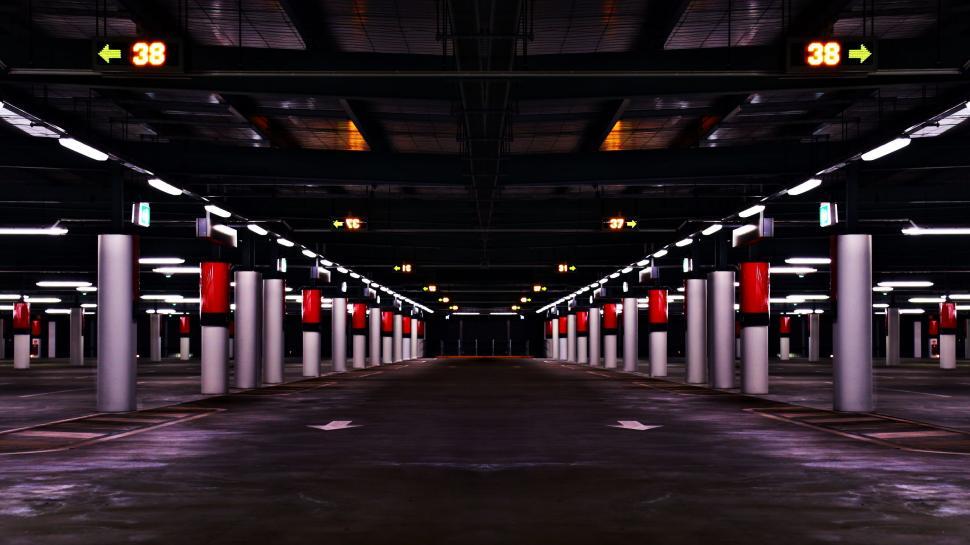 Free Image of Empty Parking Garage With Red and White Lights 