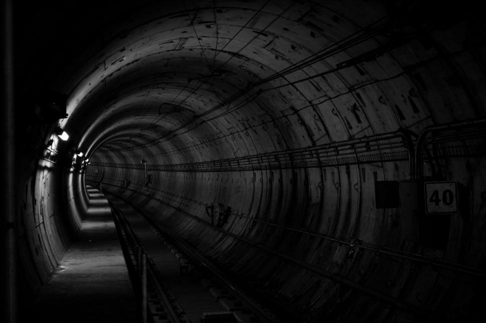Free Image of Train Passing Through Dark Tunnel 