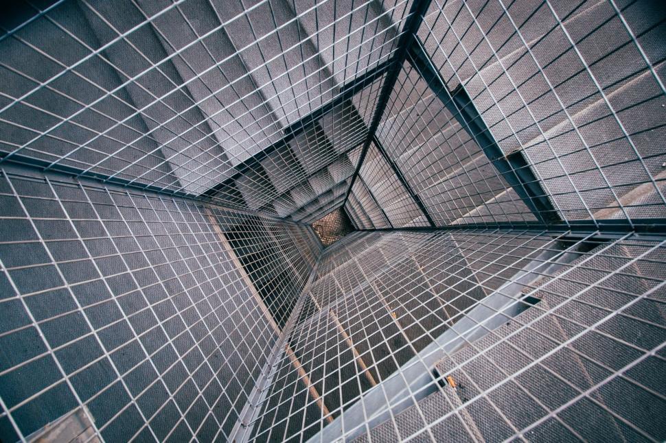 Free Image of Tall Building With Metal Cage on Ceiling 
