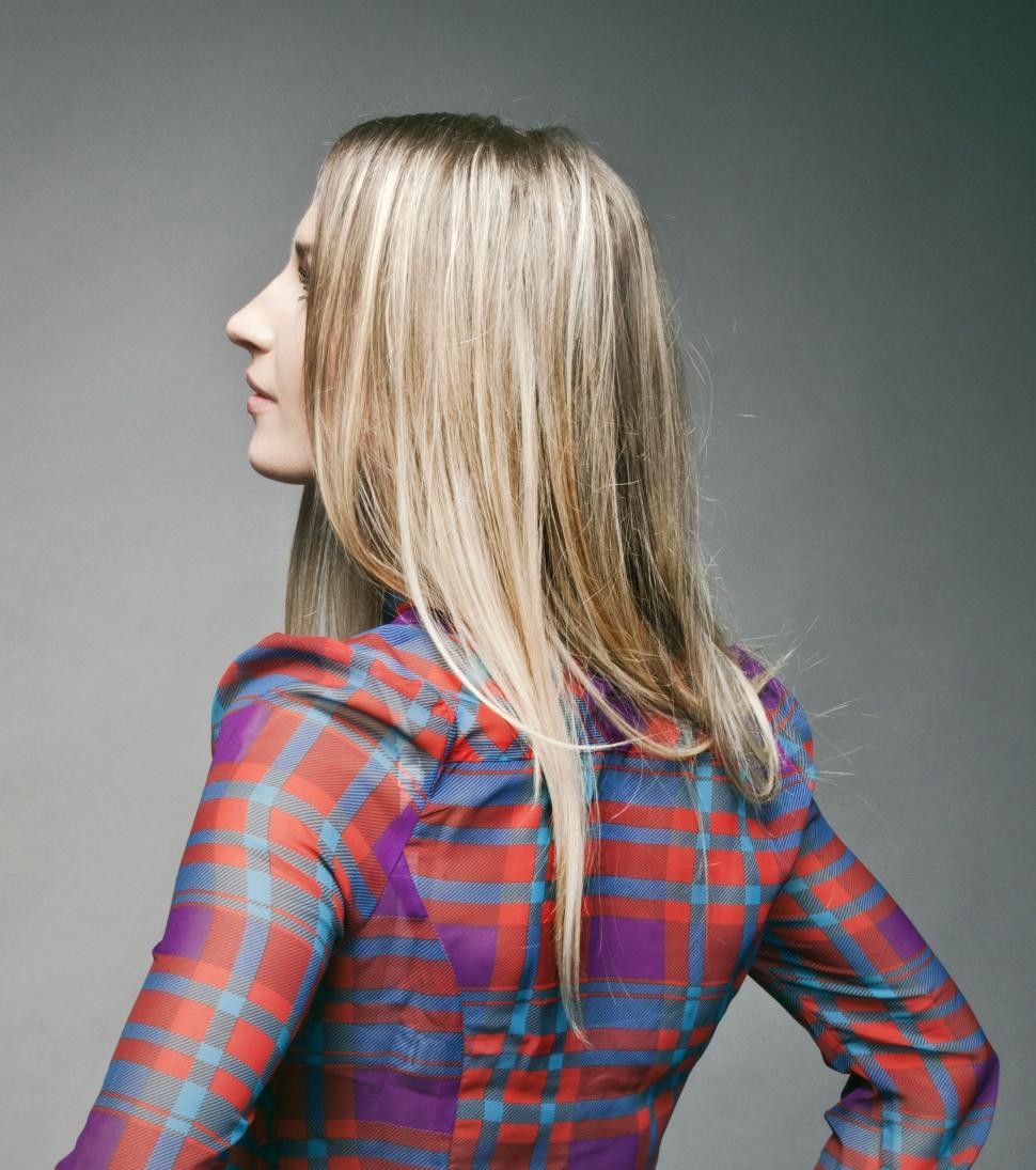 Free Image of Woman With Long Blonde Hair Wearing Plaid Shirt 