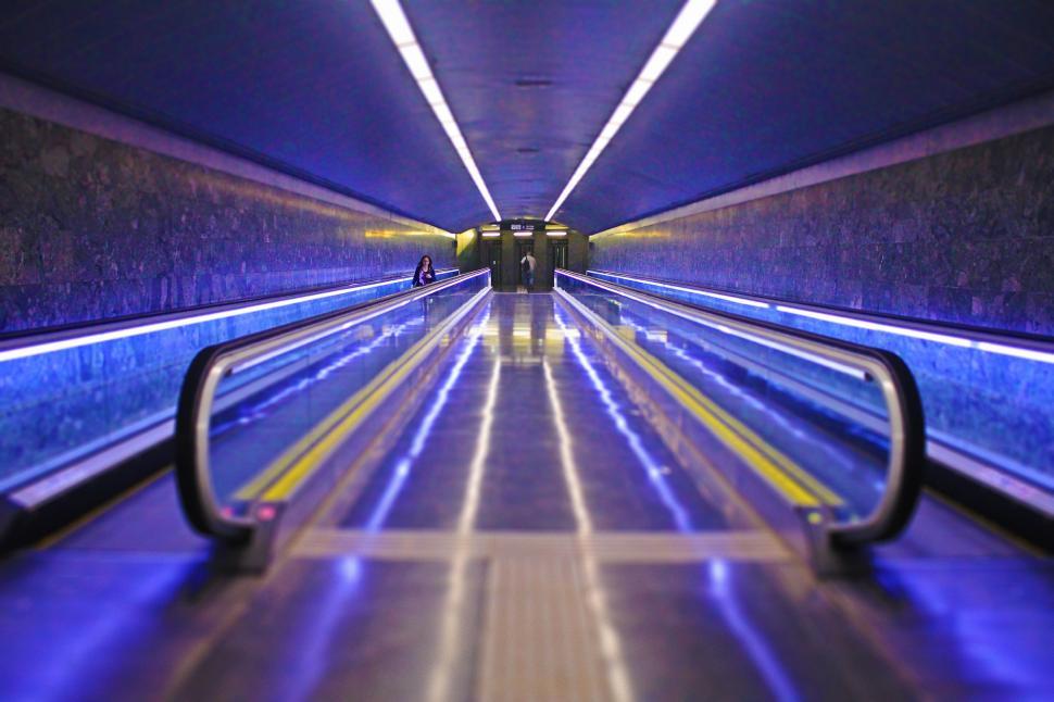 Free Image of Blue and Yellow Subway Traveling Through Tunnel 
