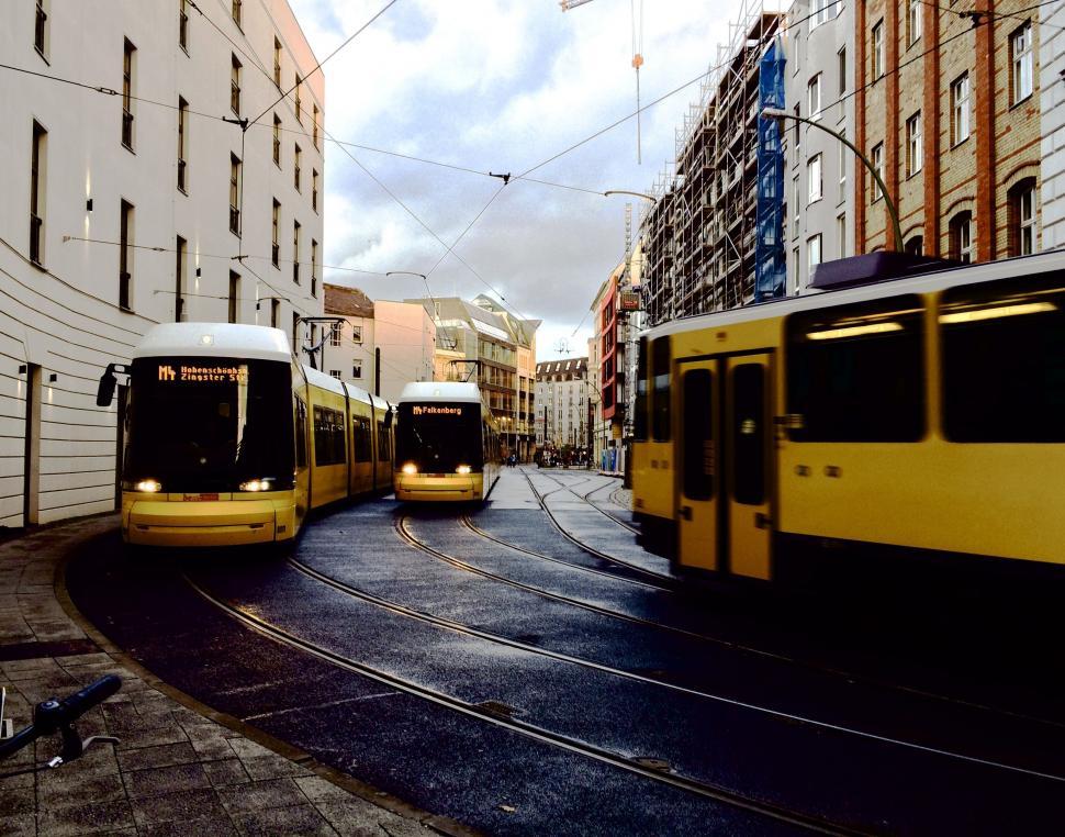 Free Image of Two Buses Parked on a City Street 