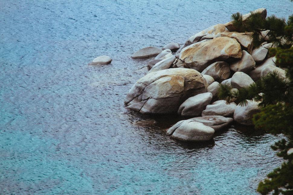 Free Image of Group of Rocks in the Middle of a Body of Water 