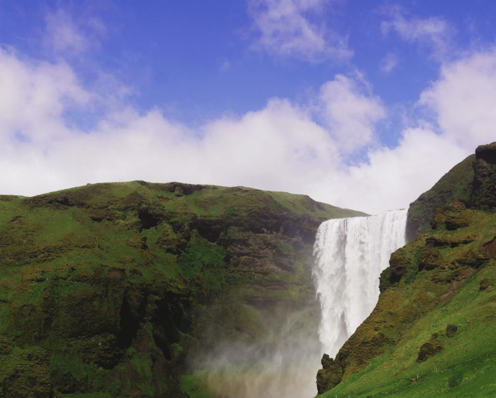 Free Image of Large Waterfall Surrounded by Grass 