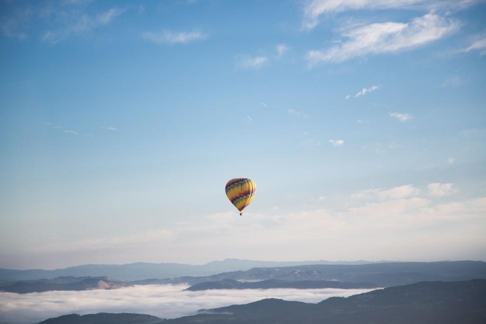 Free Image of Hot Air Balloon Soaring Above Clouds 
