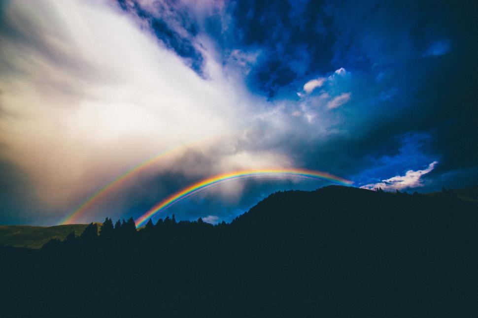 Free Image of Two Rainbows Over a Mountain 