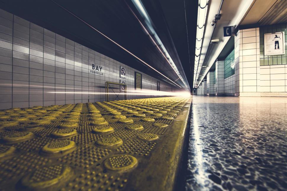 Free Image of Long Hallway With Yellow and Black Tiles 