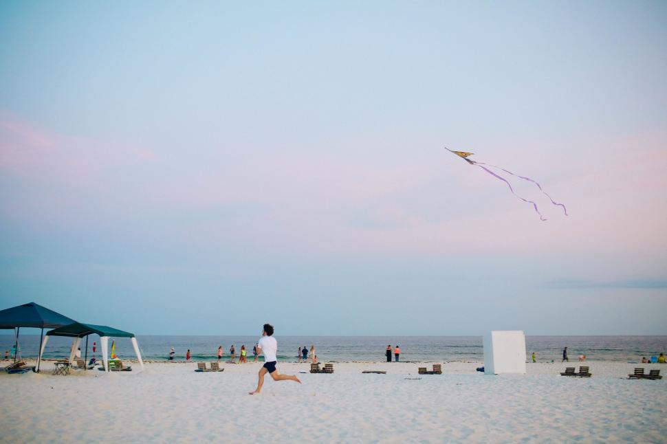 Free Image of Person Flying Kite on Beach 