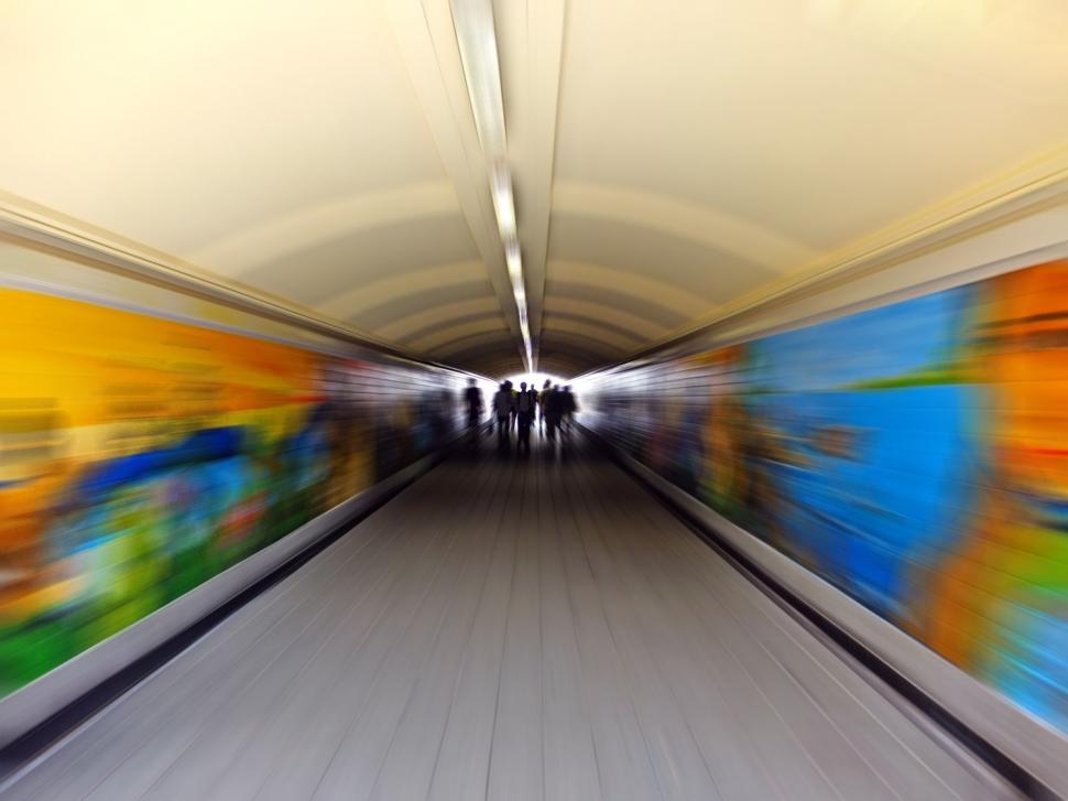 Free Image of Blurry Image of People Riding an Escalator 