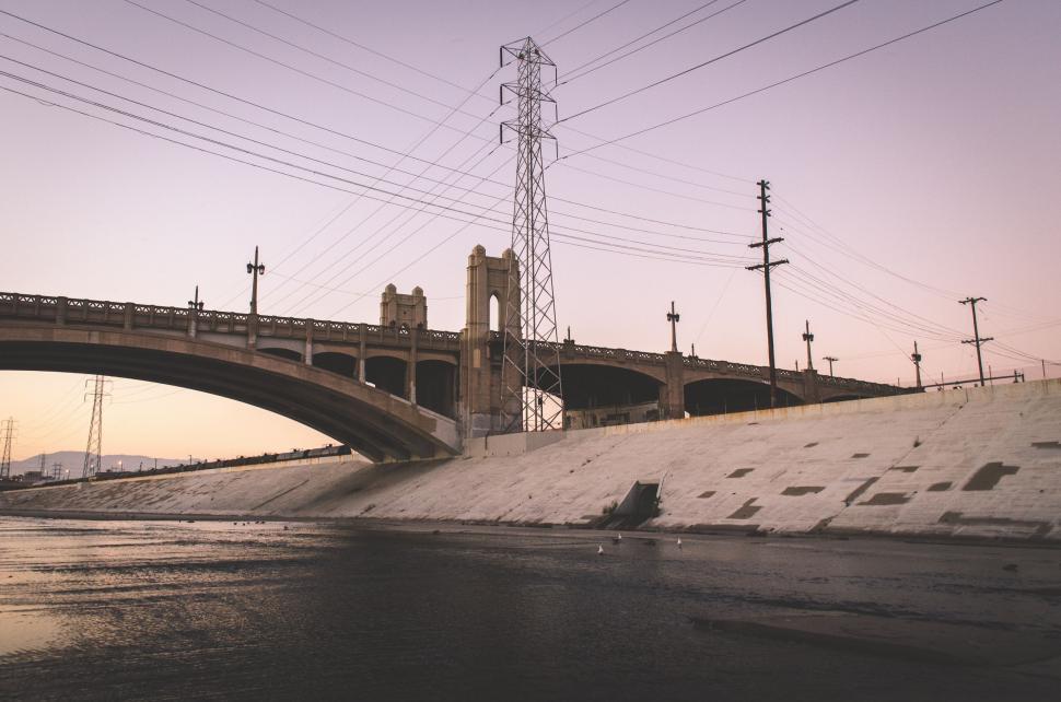 Free Image of Bridge Over Water With Power Lines 