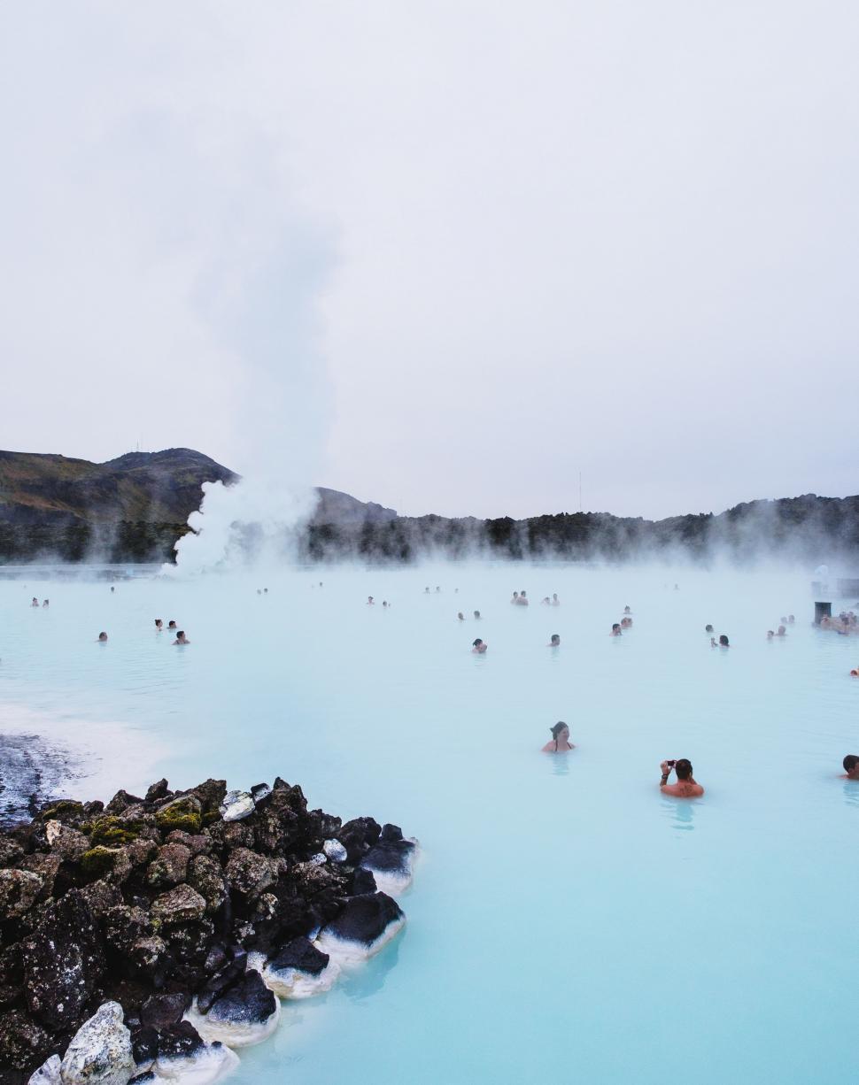 Free Image of Group of People Swimming in Blue Lagoon 