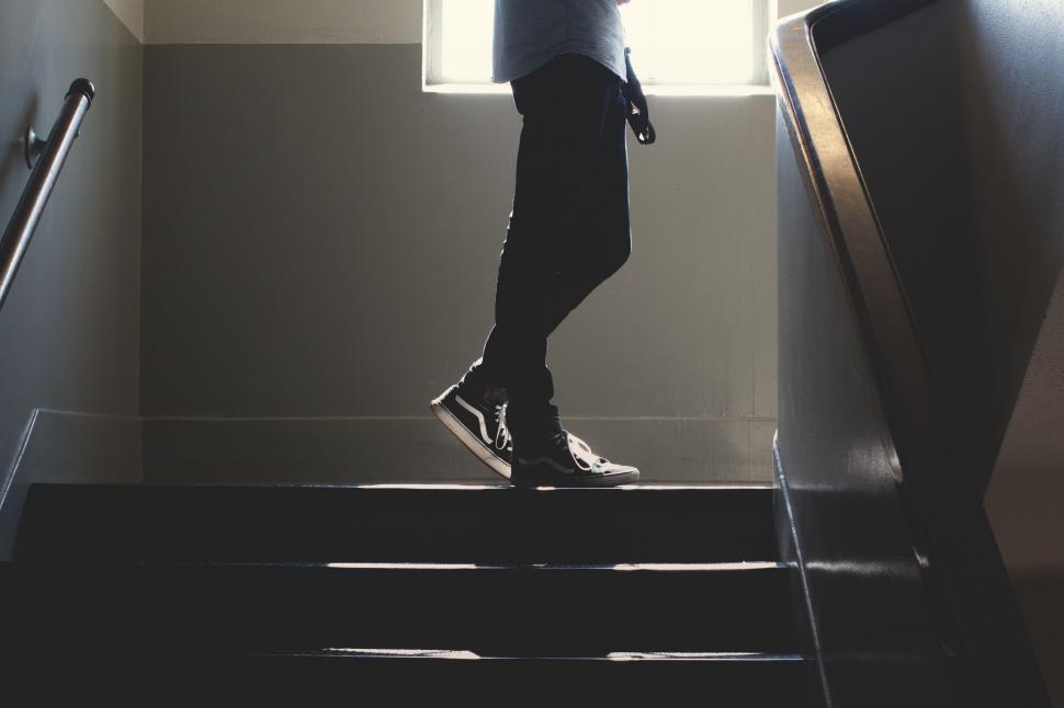 Free Image of Person Standing on a Set of Stairs 