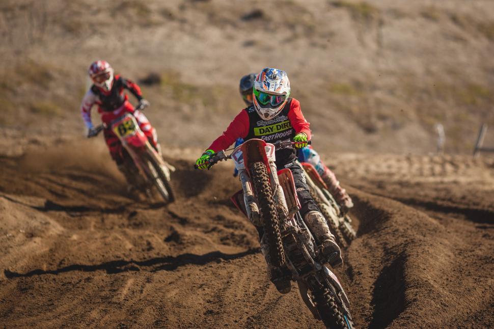Free Image of Two People Riding Dirt Bikes on a Dirt Track 