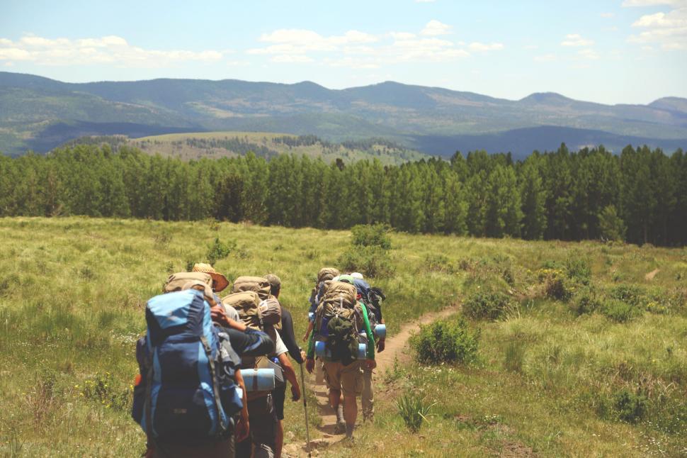 Free Image of Group of People Hiking With Backpacks on Trail 