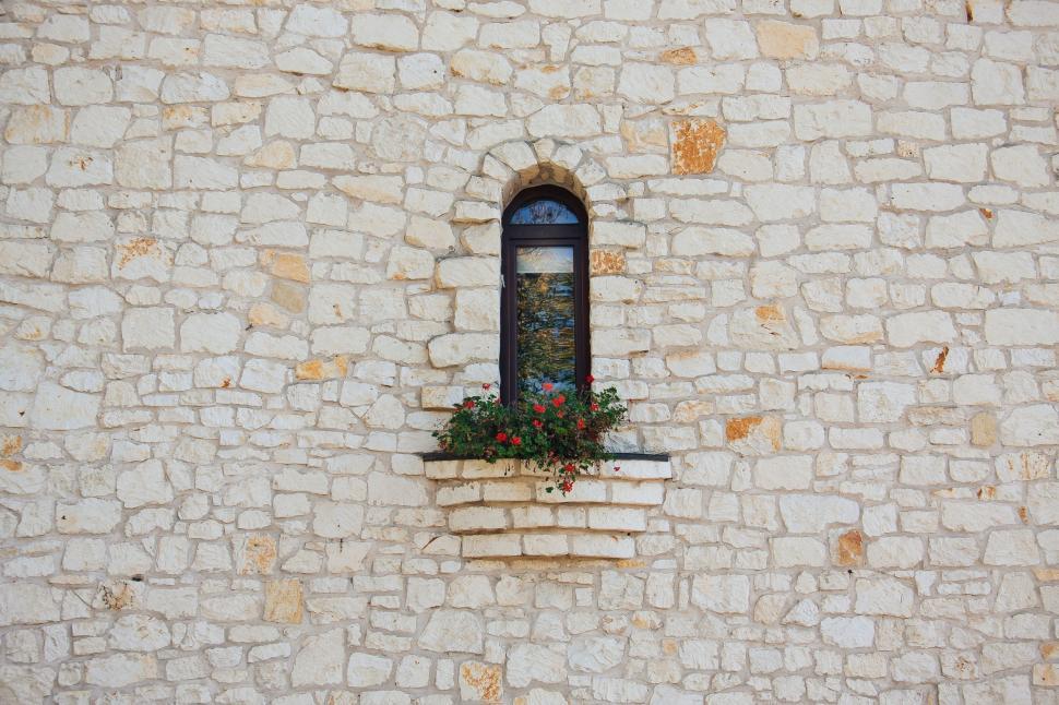 Free Image of Stone Building With Window and Planter 