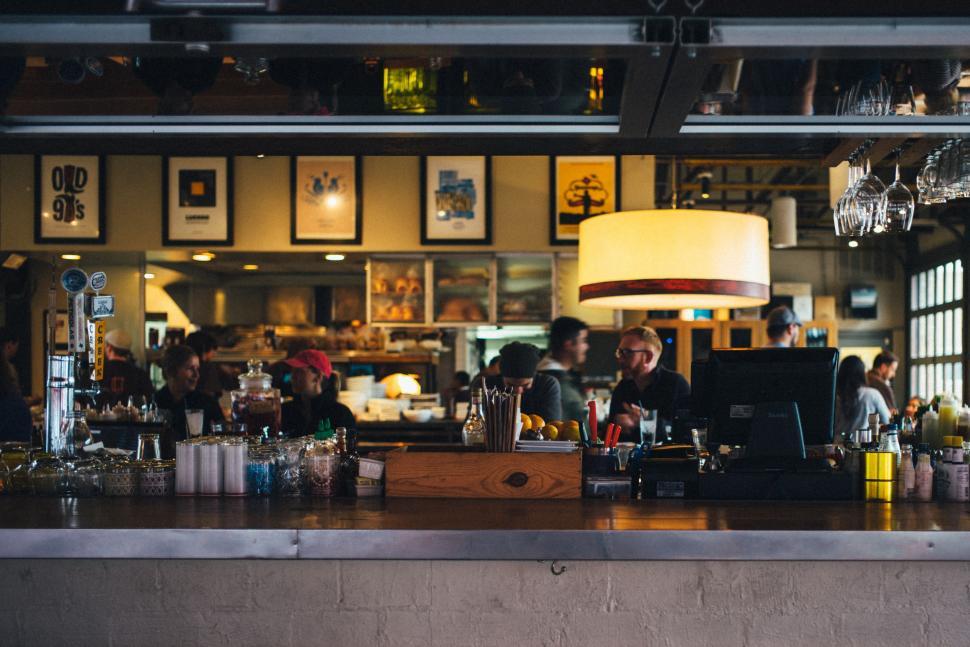 Free Image of Busy Bar With Patrons Seated at Counter 