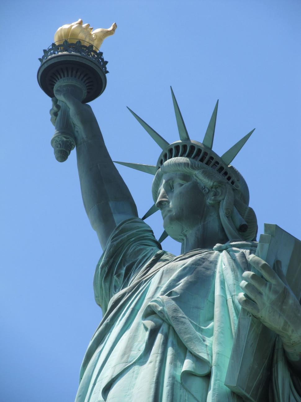 Free Image of The Statue of Liberty Holding a Book 