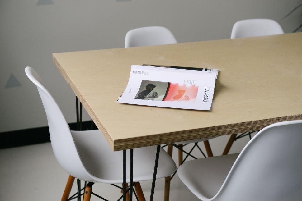 Free Image of Table With Chairs and Magazine 